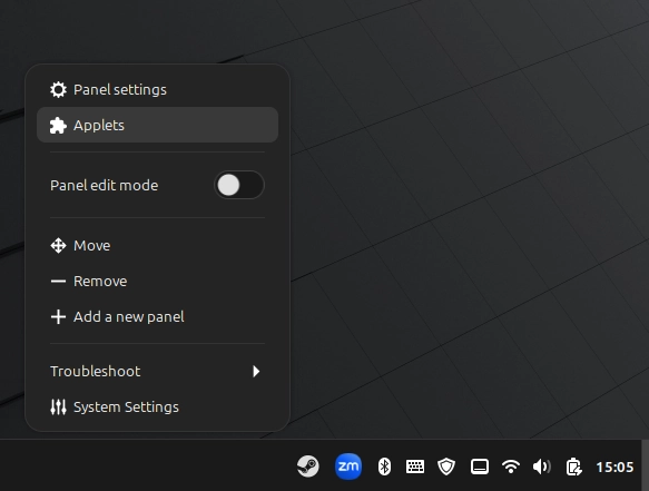 Right-click menu on the Linux Mint panel showing Panel settings and Applets options